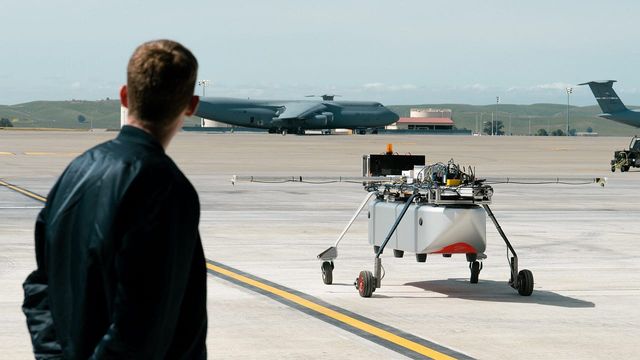 An engineer looks on at the Chaparral Ground Test Vehicle at a demonstration event at Travis AFB.