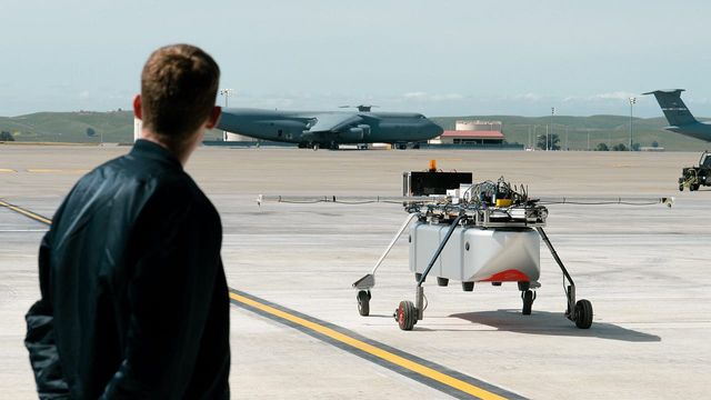 An engineer looks on at the Chaparral Ground Test Vehicle at a demonstration event at Travis AFB.