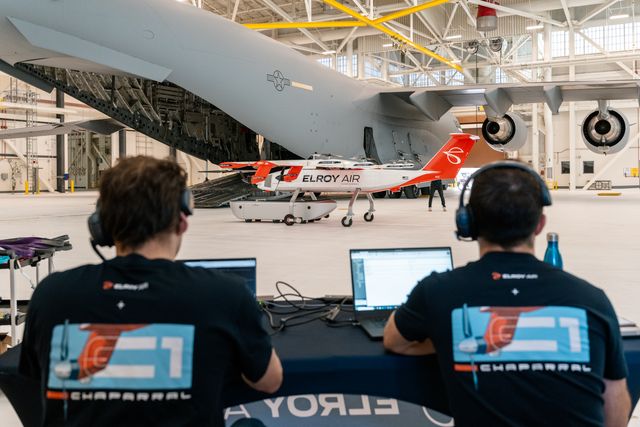 Two Elroy Air engineers look on as Chaparral demonstrates its autonomous cargo loading abilities.