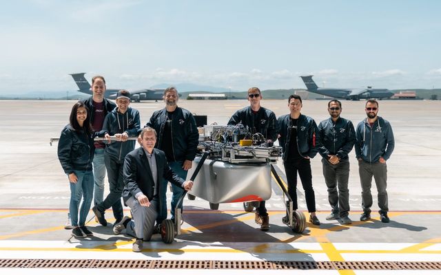 The Elroy Air team with the autonomous ground navigation and cargo-handling systems of its Chaparral aircraft, after demonstration for United States Air Force senior and executive officers as part of the Golden Phoenix Technology Demonstration Event.